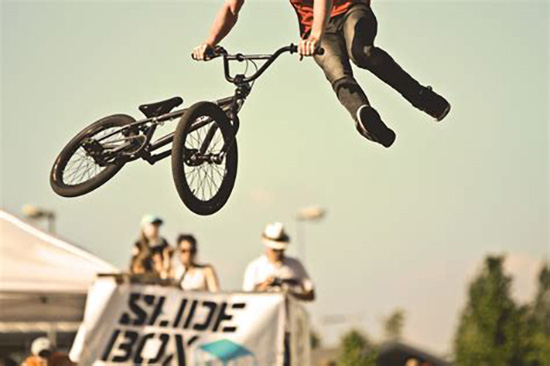 BMX Mid air tail whip action shot